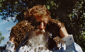 Les Lynton with bees on his face
