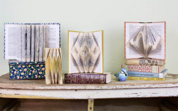 3 unique examples of recycled book arts design on a table
