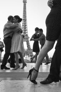 Couples dancing in front of the Eiffel Tower in Paris