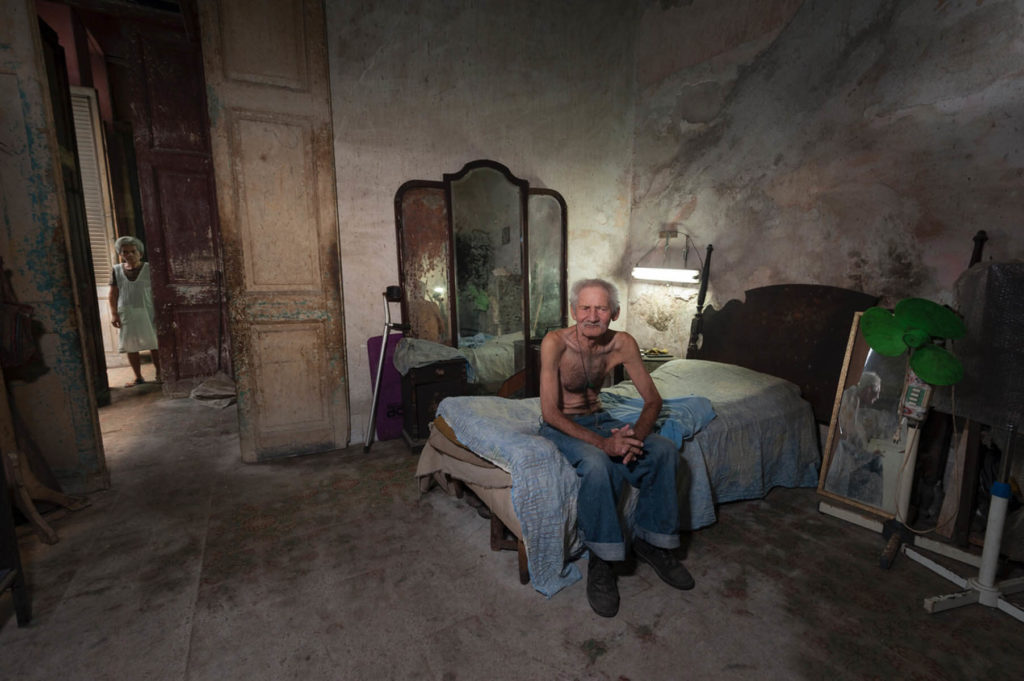 Man on Bed, Havana, Cuba - By Arlene Collins