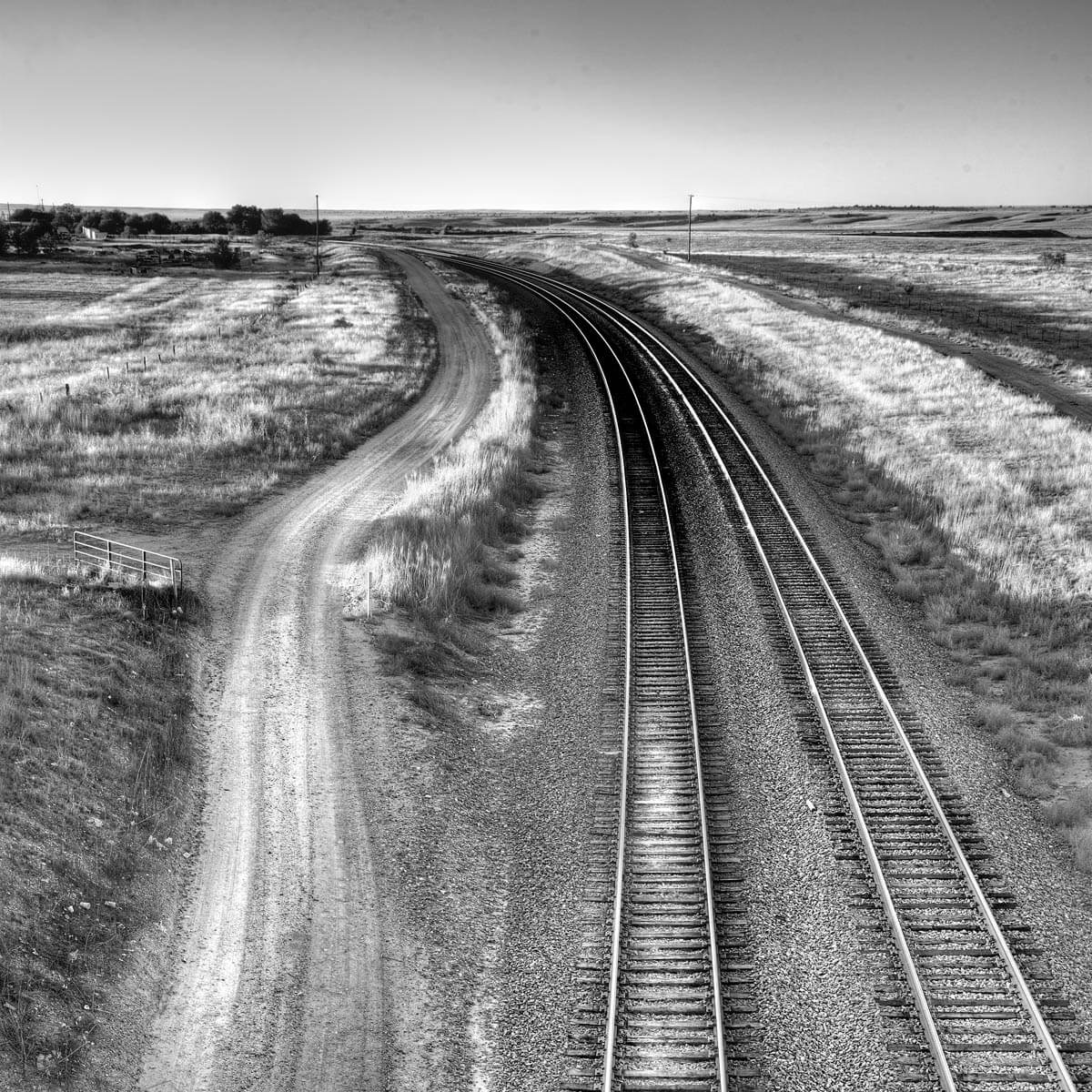 black and white photo of 2 train tracks next to each other