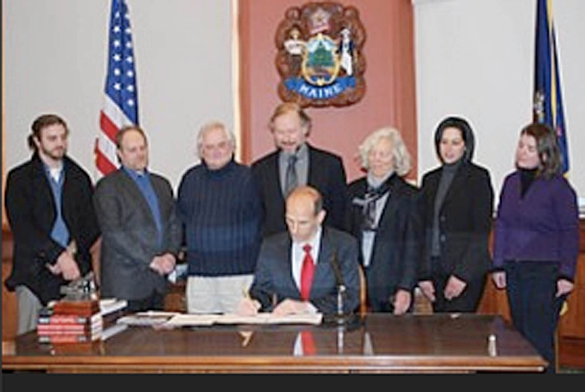 In February 2010 Governor John Baldacci signed a bill granting the school permanent authority to confer a Master of Fine Arts degree. From left to right: Faculty, Tim McLaughlin, MFA Program Chair, Howard Greenberg, Registrar, Kerry Curren, Maine Media College President, Charles Altschul, Governor John Baldacci, State Representative and Founding Board member Joan Welsh, Provost, Elizabeth Greenberg, Director of Marketing, Kate Fletcher.
